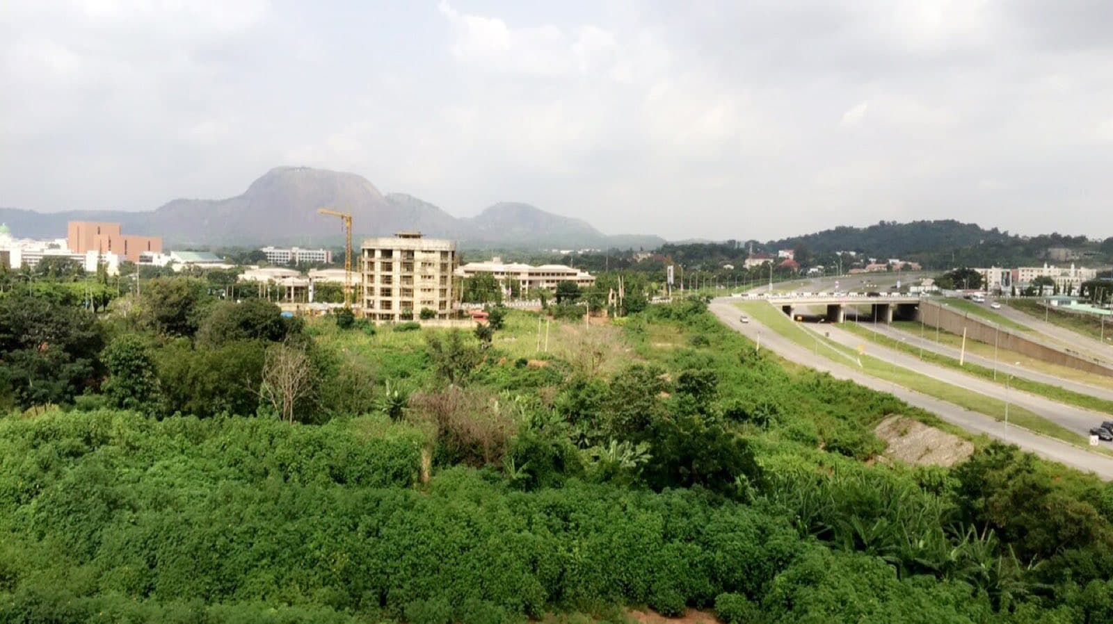 Abuja's central business district with Aso Rock and the highway beyond